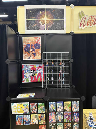 a closer look at the keychains and prints on my side of the table.