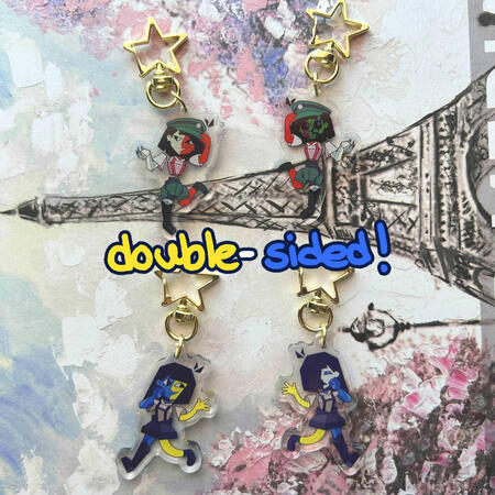 double-sided keychains of both ENAs from the eponymous web series